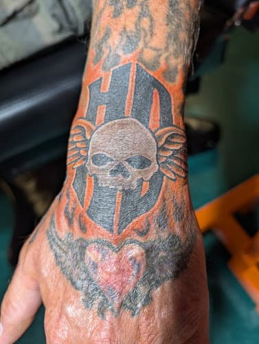 Visual Impact Tattoo logo
