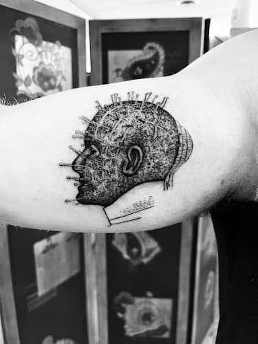 Hettinger Tattoo logo