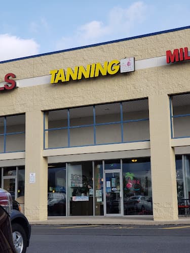 The Pink Coconut Tanning Club and Spa logo