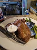 Pourhouse American Grille logo