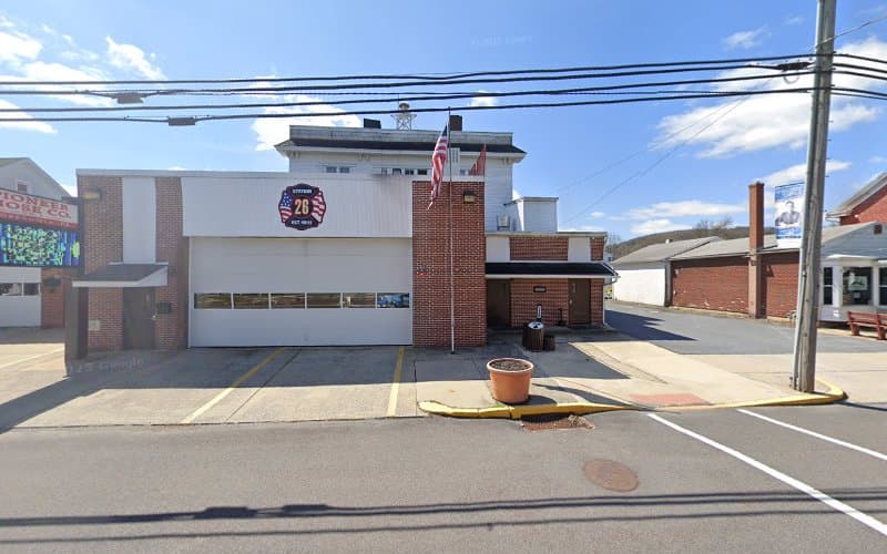 Pioneer Social Quarters and fire department 26 logo