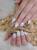 Tigon's Nails and Spa logo