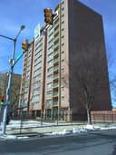 George M Rhodes Apartments logo