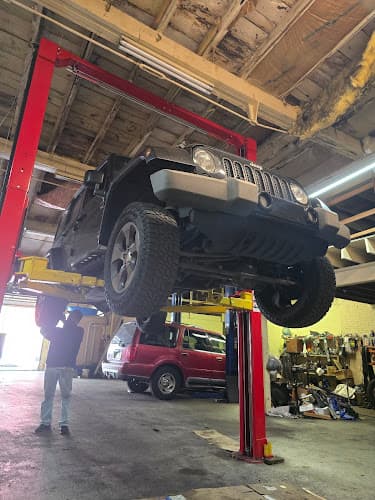 Herrera's auto Repair logo
