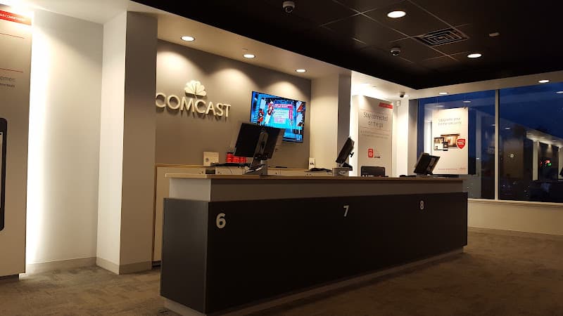 Xfinity Store by Comcast Logo