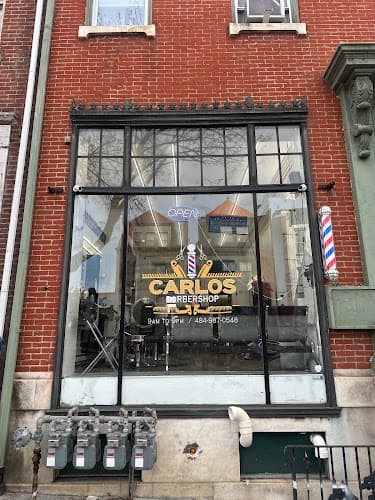 Carlos Barber Shop logo