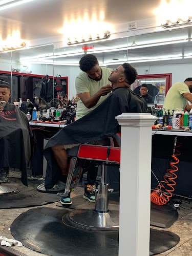 Infamous Barber Shop logo