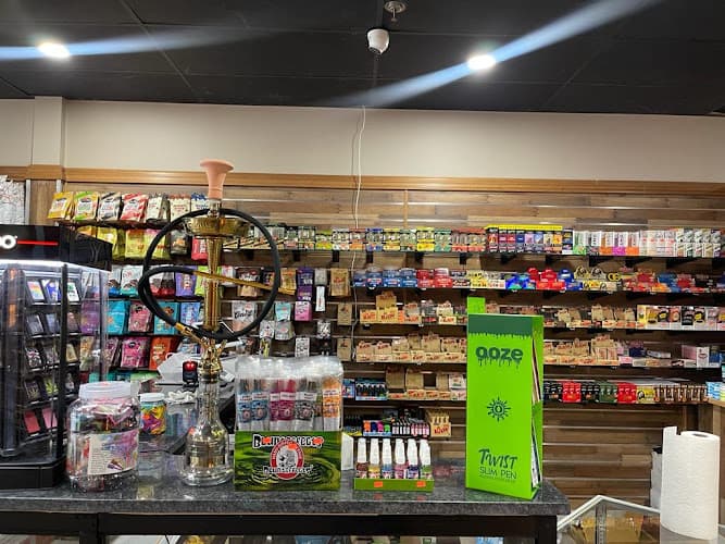 NYC convenience store INC And Smoke Shop Prime cigar Glasses vape shop cbd Energy drinks and more logo