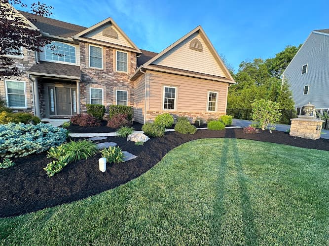Touch of Eden Lawn Care logo