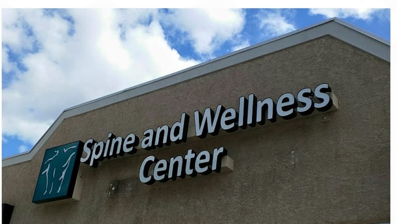 The Spine and Wellness Center logo