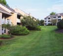 Woodgate Apartments logo