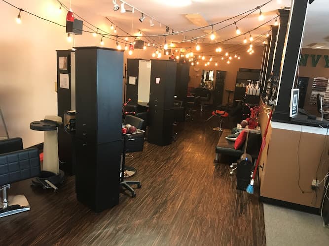 Envy Hair, Nail and Tanning Studio logo